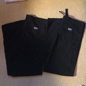 A pair of 2 Cherokee workwear black scrub pants